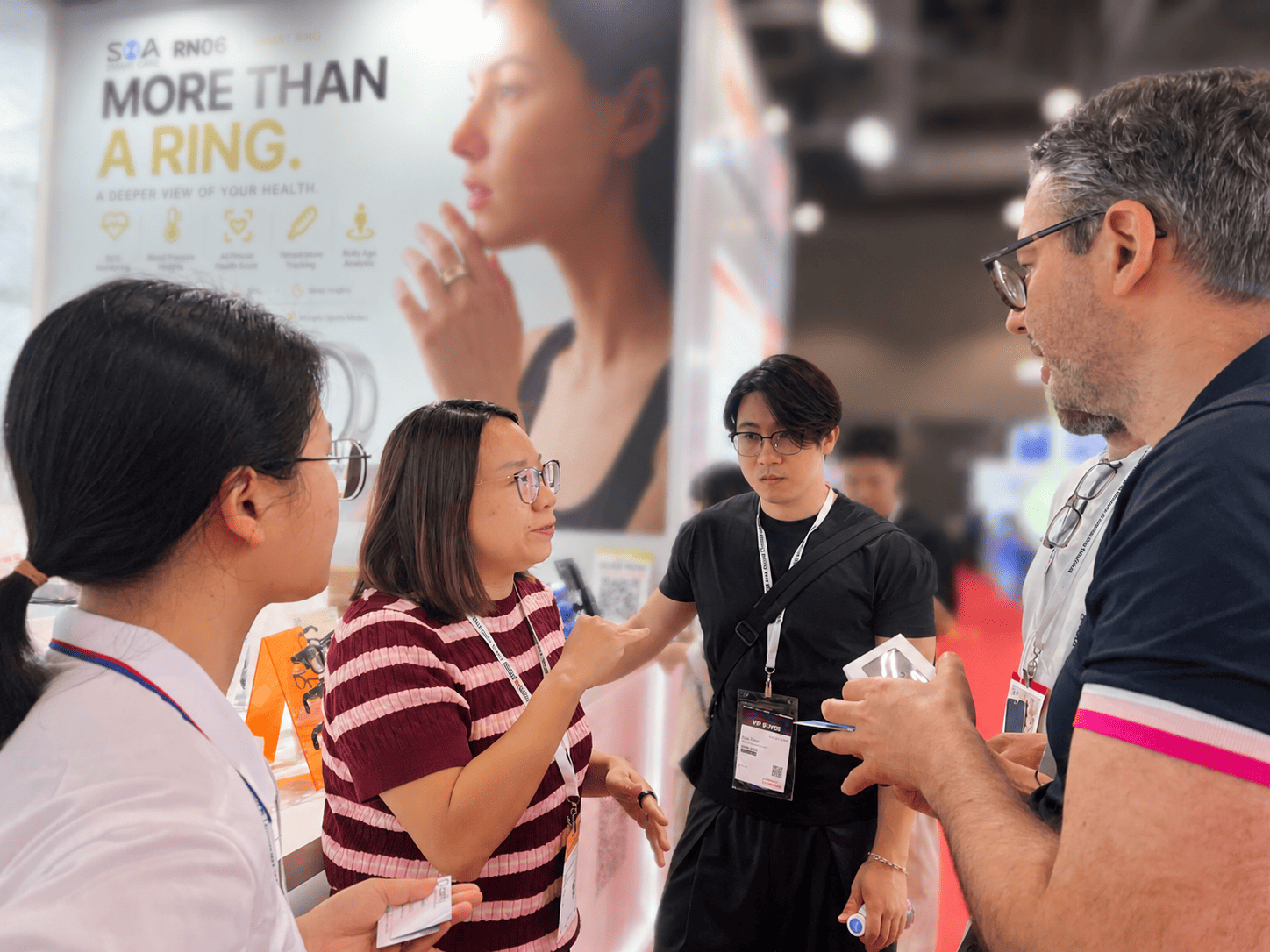Overseas buyers testing our unisex open-ear smart glasses and custom smartwatches at Booth 5A19